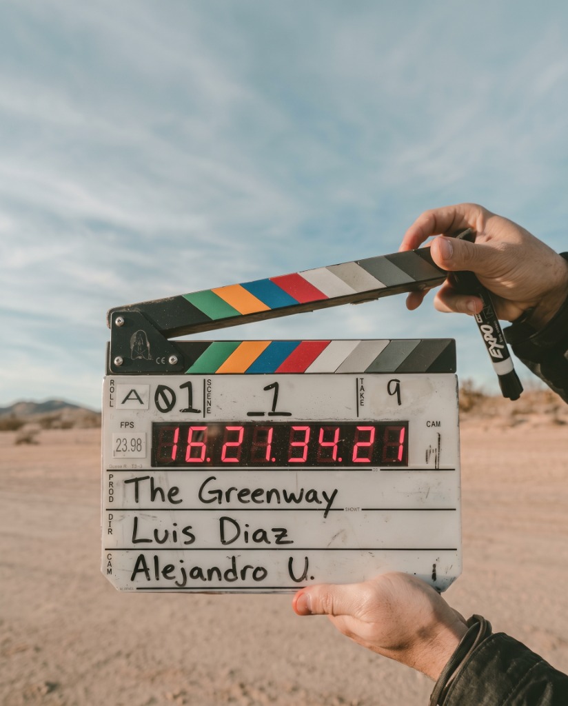 Luis Diaz directing film production on set: clapperboard for The Greenway
